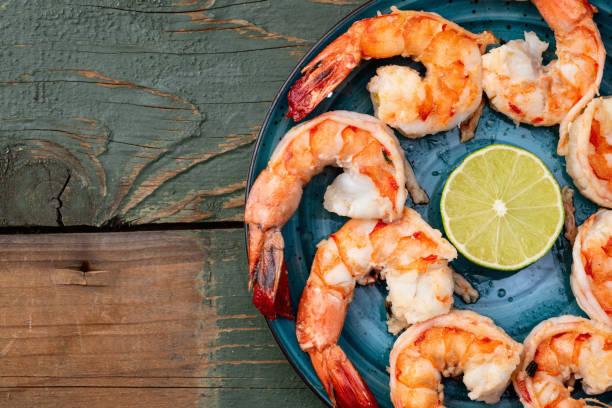 istock Grilled Tiger shrimps with lime photography . Top view 2187980931
