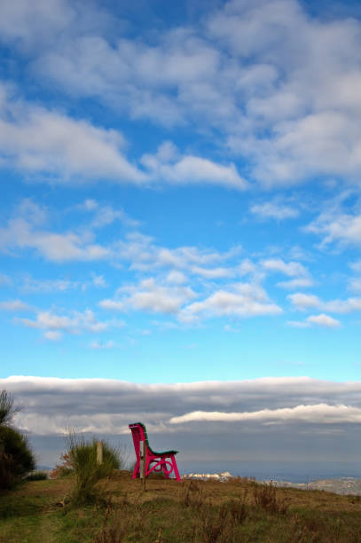 The Big Bench number 393 of Tavoleto, located on Monte San Giuovanni, against the cloudy sky