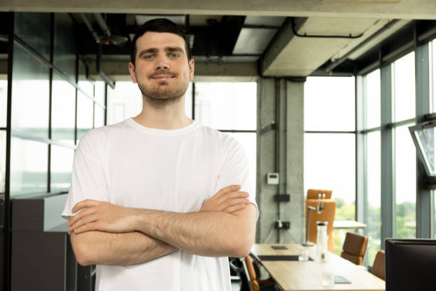 istock Happy young entrepreneur smiling in coworking space 2187982291