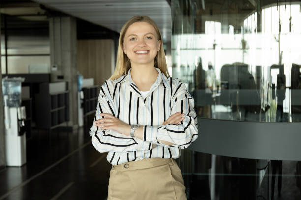 istock A young girl is standing in the office 2187982462
