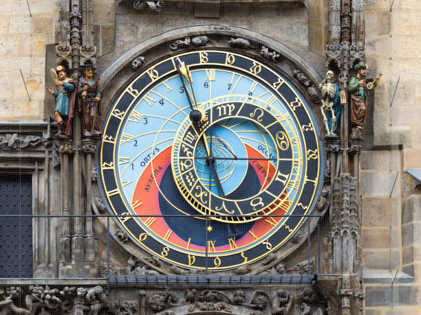 Prague, Astronomical Clock (Pražský orloj) close up on the old town hall tower in the city. The historical mechanism on the exterior wall is a popular tourist attraction.