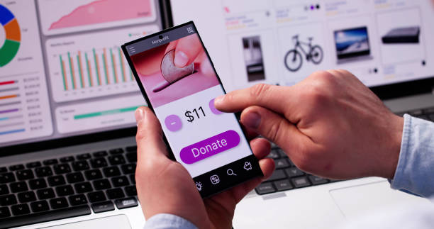 istock Man Using Online Money Donation Mobile Phone 2187984562