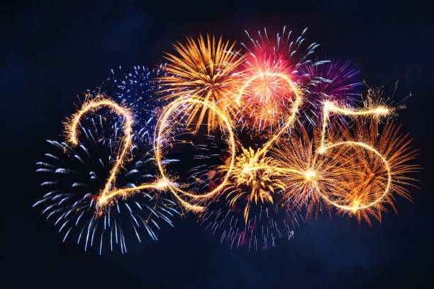 istock 2025 New year Sparkle fireworks display in night sky, bengal sparkles illumination background 2187985532