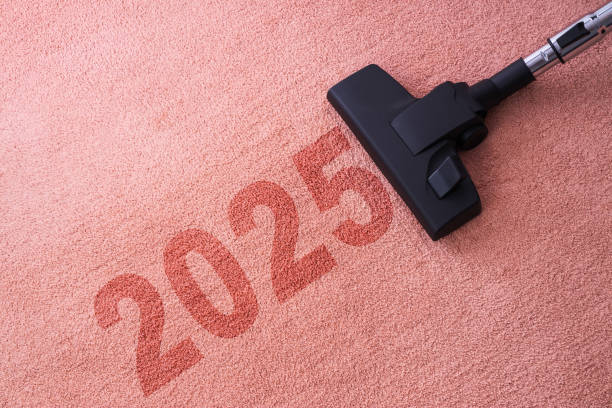 istock 2025 New year home cleaning with vacuum cleaner and copy space for a text 2187985682