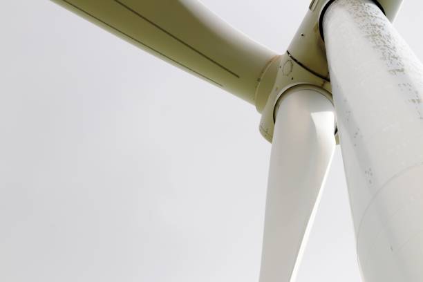 istock Wind turbine close-up against cloudy sky. 2187986355