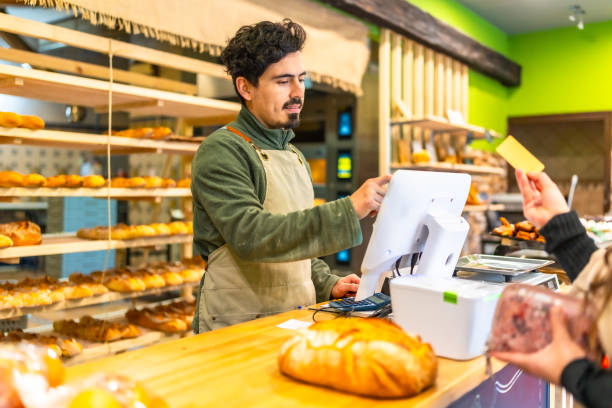 istock Woman checking out in an artisan bakery 2187987150