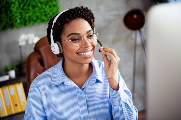 istock Confident African American businesswoman in an office setting using a headset for a virtual meeting or customer service call 2187988600