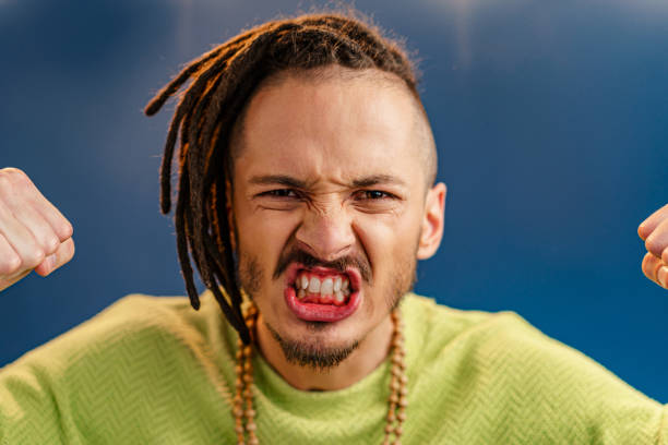istock Portrait of a happy positive guy with dreadlocks 2187988683
