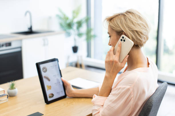 istock Caucasian woman using tablet for online food delivery order 2187989241