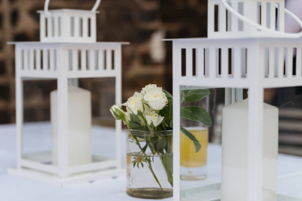 istock White Lanterns and Roses Wedding Table Decoration 2187990633