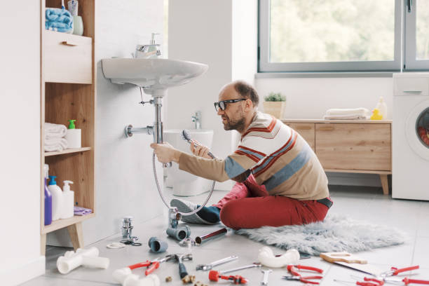 istock Confused man repairing his bathroom sink 2187991007
