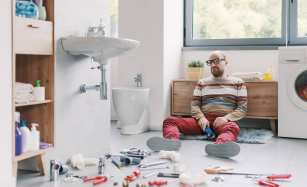 istock Desperate man unable to fix his broken sink 2187991048