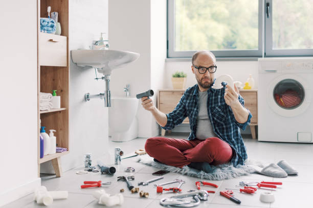 istock Confused man trying to fix the bathroom sink by himself 2187991092