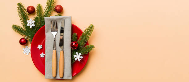 istock Christmas table place setting with christmas decor and plates, kine, fork and spoon. Christmas holiday background. Top view with copy space 2187991201