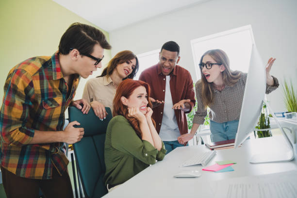Photo of angry shocked students studying business school having task trouble modern device indoors workplace workstation.