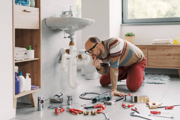istock Man failing at DIY plumbing at home 2187991386