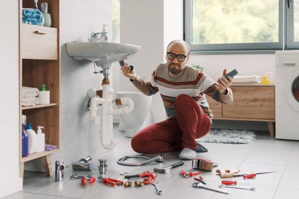 istock Confused man unable to fix his bathroom sink 2187991395