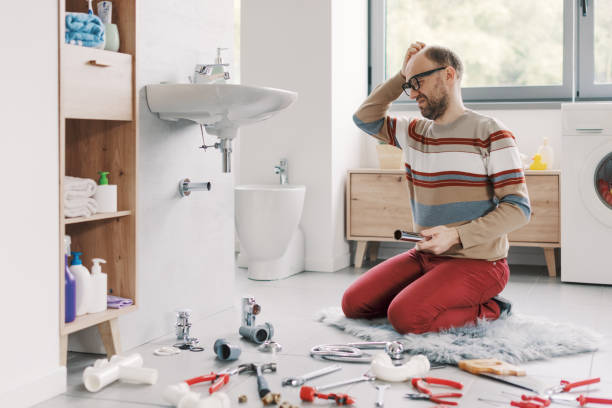 istock Confused man repairing his bathroom sink 2187991418