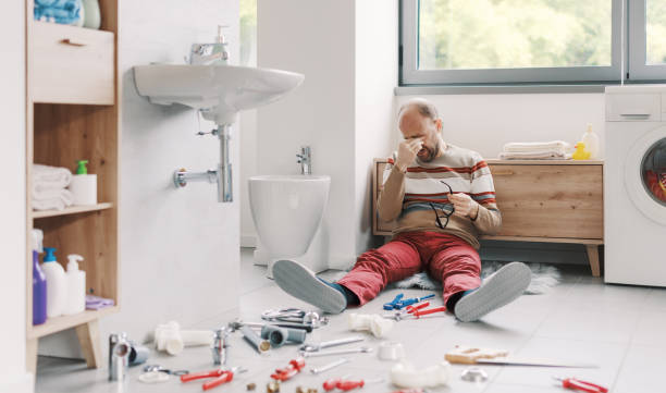 istock Desperate man unable to fix his broken sink 2187991468