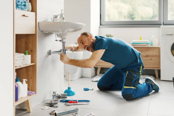 istock Angry plumber repairing a bathroom sink 2187991521