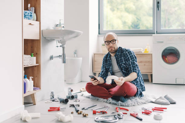 istock Confused man searching sink parts online 2187991537