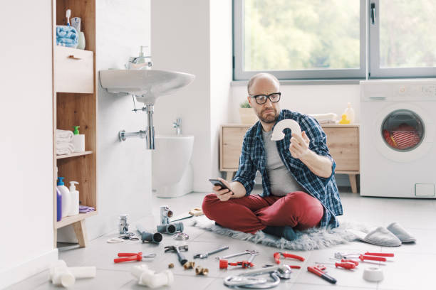 istock Confused man searching sink parts online 2187991598