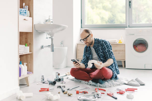 istock Confused man searching sink parts online 2187991652