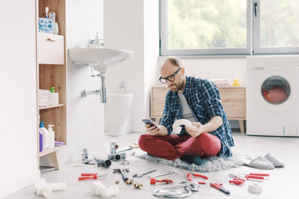 istock Confused man searching sink parts online 2187991749