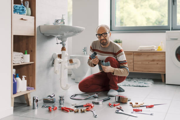 istock Confused man unable to fix his bathroom sink 2187991795