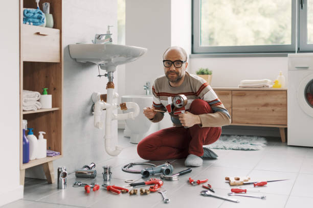 istock Inexpert man fixing his sink drain using adhesive tape 2187991836