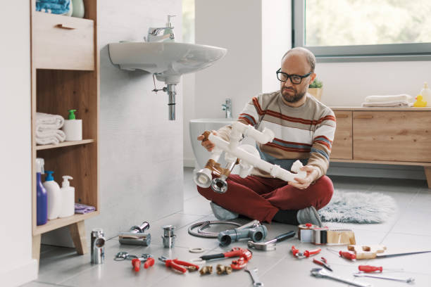 istock Confused man staring at plumbing pipes 2187991844