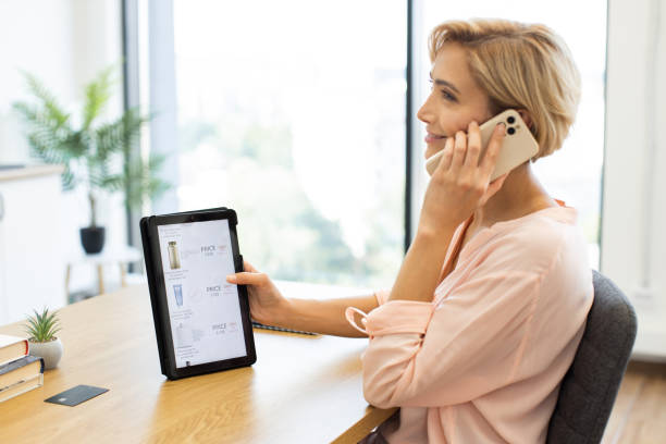 istock Caucasian woman ordering cosmetics online using phone and tablet 2187991881