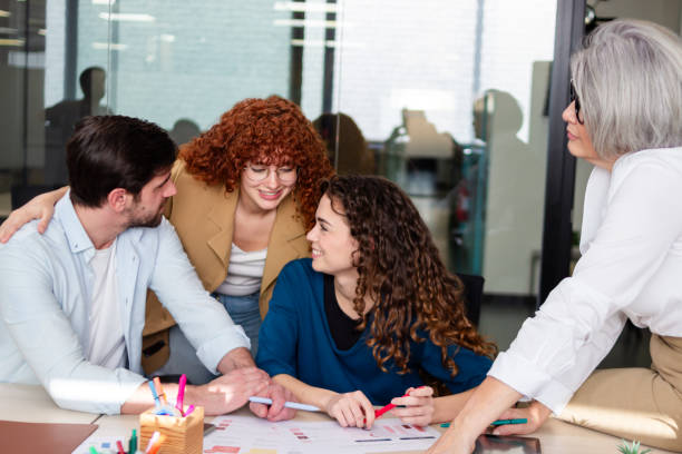 istock Coworkers collaborating on project in modern office 2187992632