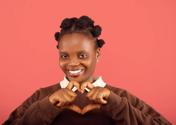 istock Young lady making a heart sign 2187993158