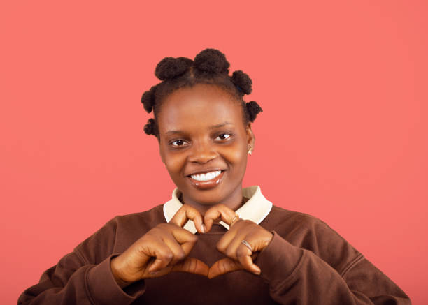 istock Young lady making a heart sign 2187993178