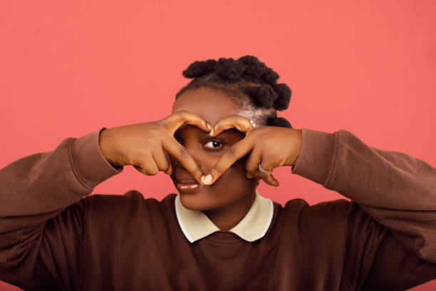 istock Young lady making a heart sign 2187993230