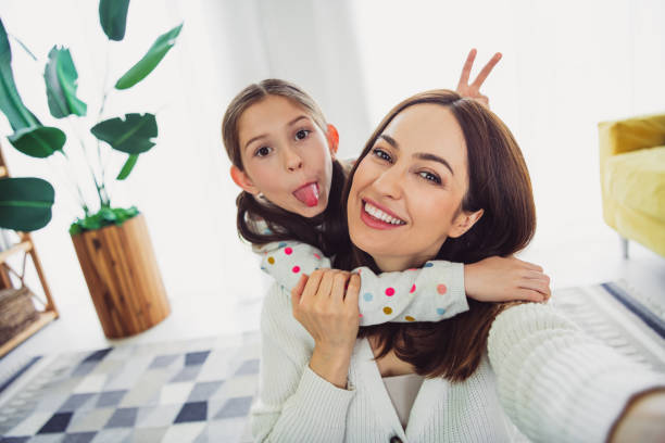 istock Joyful young mother and daughter having fun at home on a beautiful spring day 2187995686
