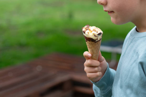 istock Child enjoying ice cream cone outdoors in summer 2187995979