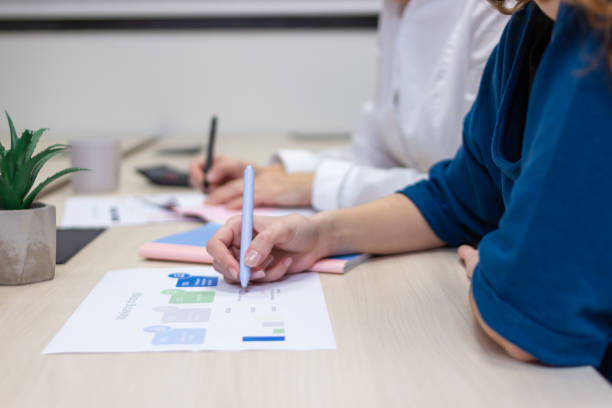 istock Coworkers analyzing marketing strategy together in coworking space 2187996365