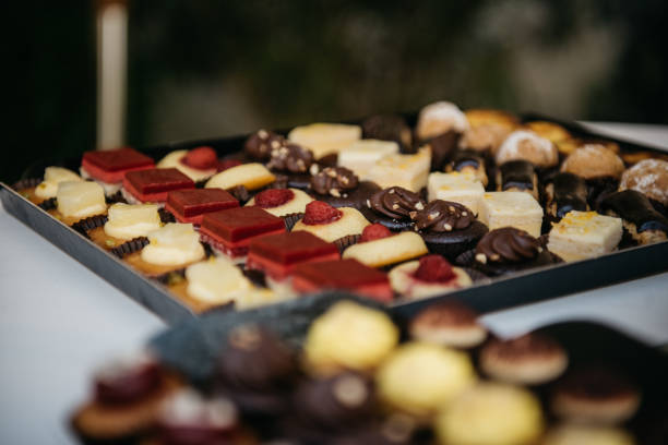 istock Assorted Gourmet Desserts and Chocolates on Black Tray 2187998421