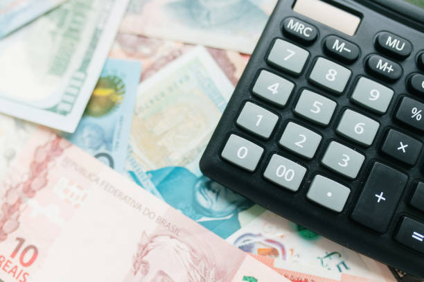 istock Calculator on paper currency 2187998597
