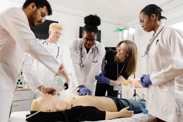 istock Medical personnel demonstrating cpr on dummy 2188000345
