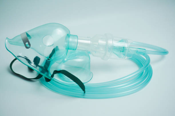 istock Nebulizer mask isolated on white background. A nebulizer mask is a mask that is used in a nebulizer to convert liquid medicine into vapor so that it is easy for the patient to inhale. Top view 2188002027