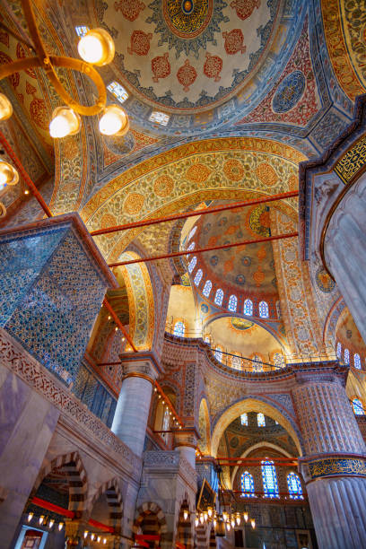 istock interior of mosque, domes are painted with patterns, decorative windows and columns, chandeliers, beautiful architecture of Islamic religion, Istanbul, Turkey 2188002250