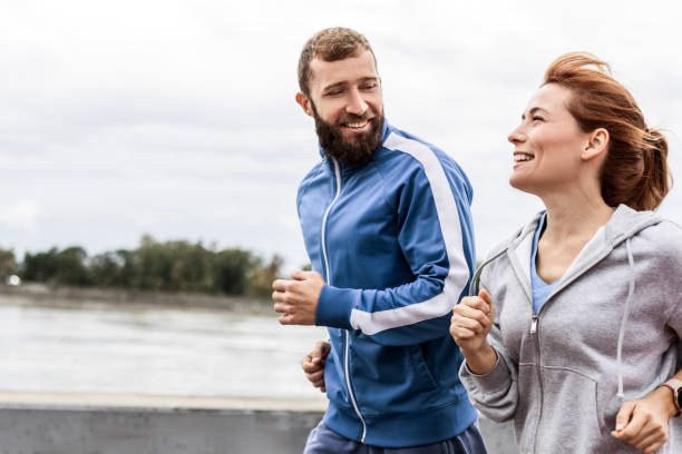 istock Cheerful Couple Enjoying a Run 2188003134