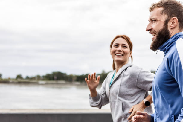 istock Young Couple Running Outdoors 2188003141