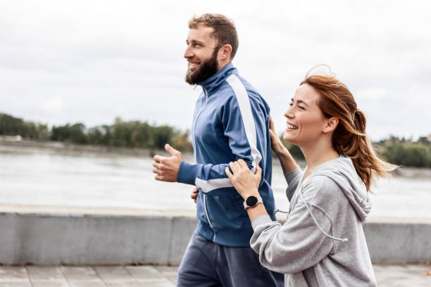 istock Couple Staying Fit and Happy While Running Outside 2188003165
