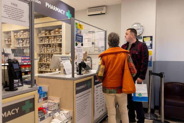 Grandson Assisting Grandmother at the Pharmacy