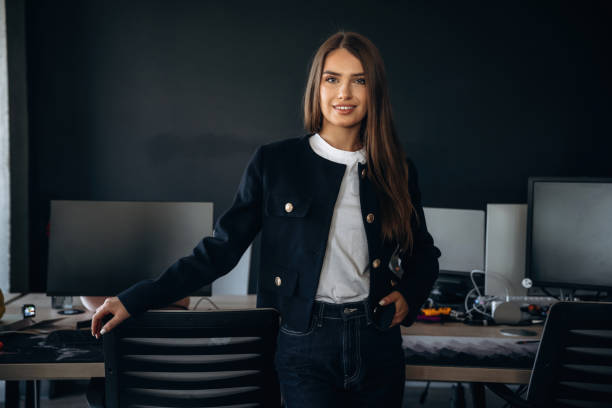 istock Cheerful beautiful woman is standing indoors 2188008178