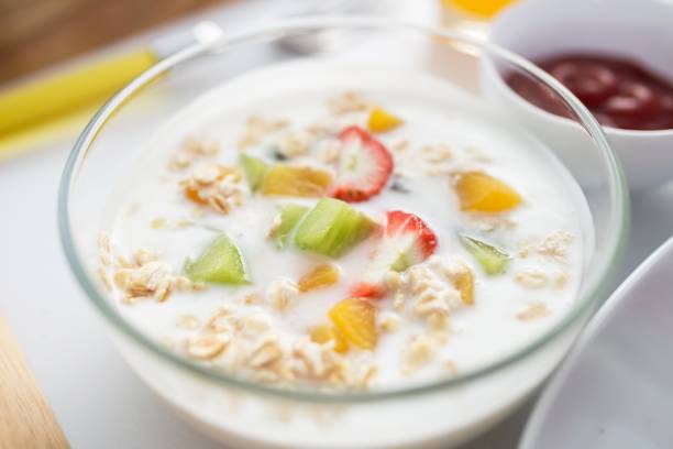 Oatmeal with fresh fruits and nuts for breakfast
